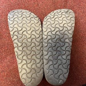 Brown Birkenstock clogs.